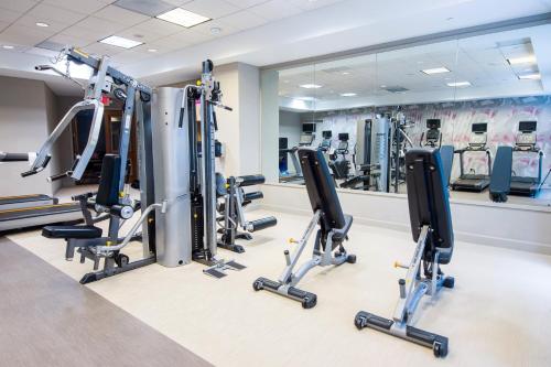 a gym with a row of tread machines at Crowne Plaza Cleveland at Playhouse Square by IHG in Cleveland