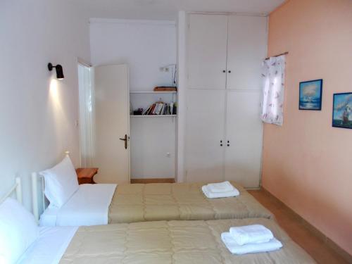 Postel nebo postele na pokoji v ubytování Eva Apartments