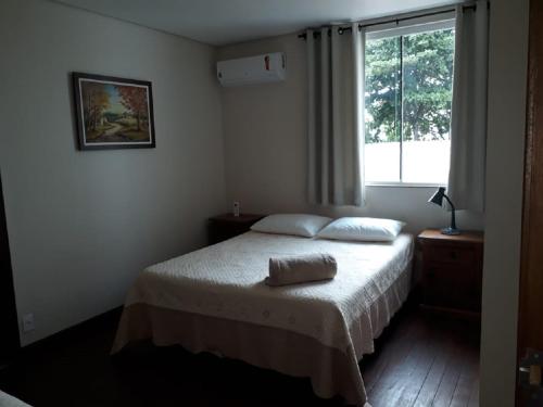 מיטה או מיטות בחדר ב-Casa da Praia