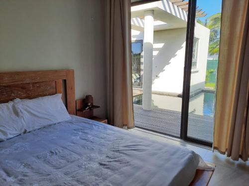 Кровать или кровати в номере Ohana Retreat Villa