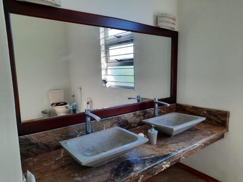 Ένα μπάνιο στο Ohana Retreat Villa
