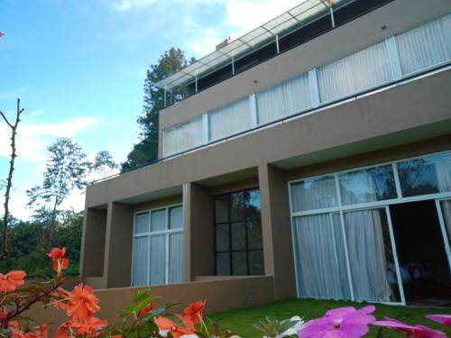 a building with flowers in front of it at Lilara Hills - Diyatalawa in Diyatalawa