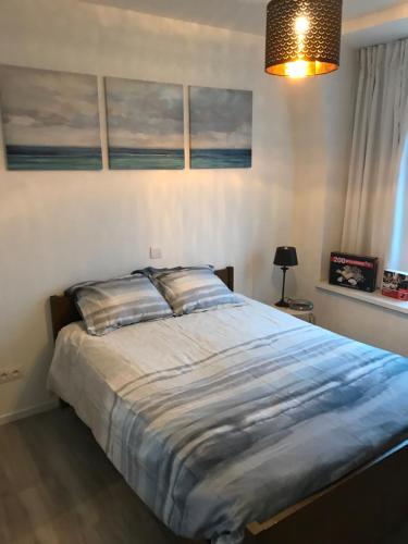 Een bed of bedden in een kamer bij Residentie Palace Zeebrugge