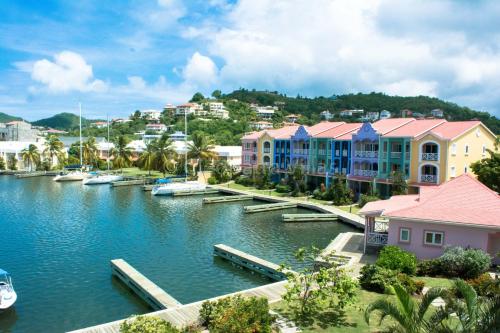 a view of a marina with boats in the water at The Harbour in Rodney Bay Village