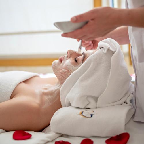a woman getting a massage at a spa at Hotel Costa Galana in Mar del Plata