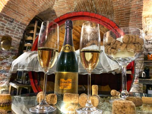 three glasses of wine sitting on top of a table at Al Silter in Capriate San Gervasio