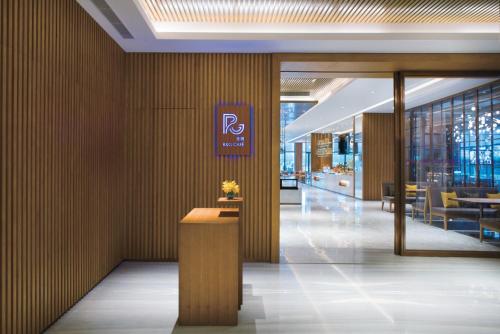 a lobby of a building with a sign on the wall at Crowne Plaza Hangzhou Qiantang - The subway can reach the West Lake scenic area as well as the airport and high-speed rail station, adjacent to Jinsha Lake and Longfor paradise walk in Hangzhou