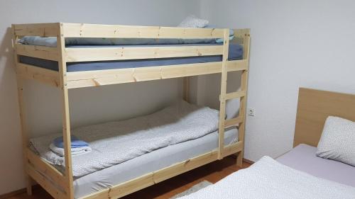 Postel nebo postele na pokoji v ubytování Apartment Centar