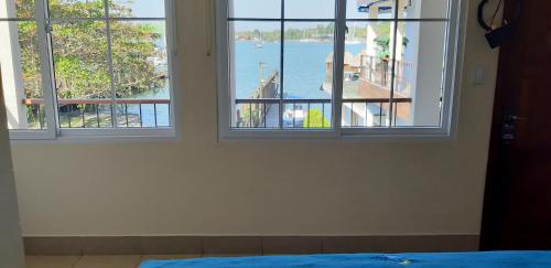 Ένα ή περισσότερα κρεβάτια σε δωμάτιο στο Hotel Real del Rio
