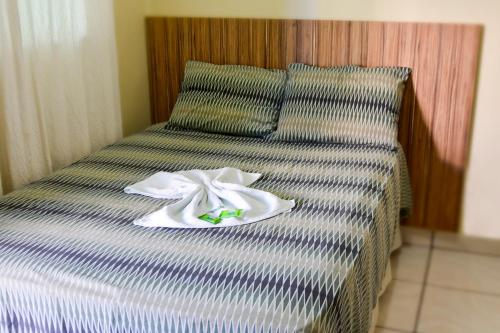 A bed or beds in a room at Araguaia Hotel