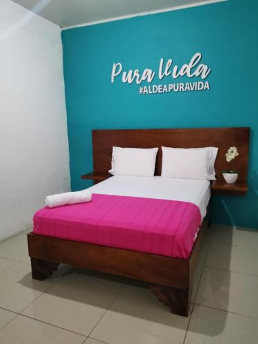 Ένα ή περισσότερα κρεβάτια σε δωμάτιο στο Puntarenas Bed & Coffee by Aldea