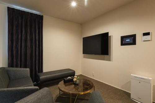 TV a/nebo společenská místnost v ubytování GRAND BASE Nagasaki City