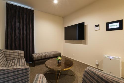 TV a/nebo společenská místnost v ubytování GRAND BASE Nagasaki City