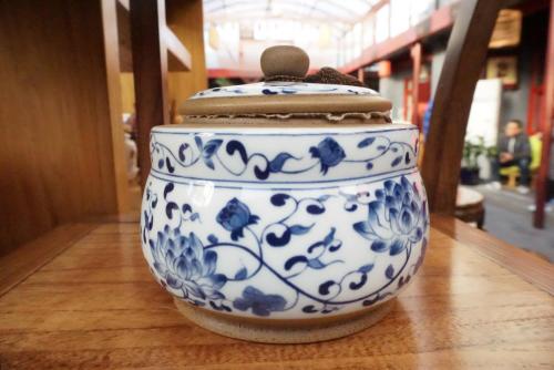 a blue and white vase sitting on a table at Beijing Yue Bin Ge Courtyard Hotel in Beijing