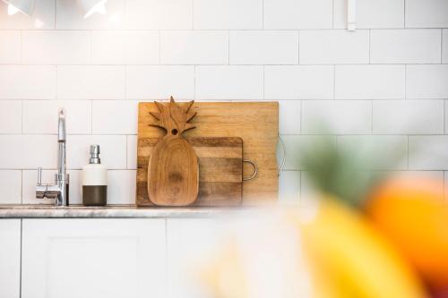 a kitchen counter with a cutting board on a counter top at Villa Atma in Seminyak