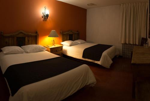 Hotel Posada Santa Berthaにあるベッド