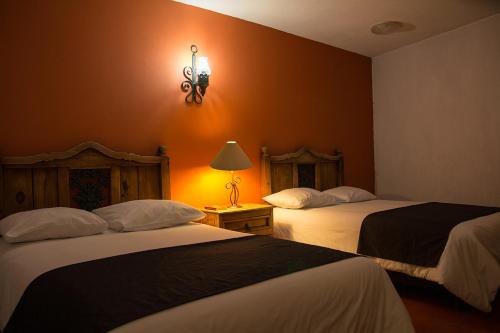 Hotel Posada Santa Berthaにあるベッド