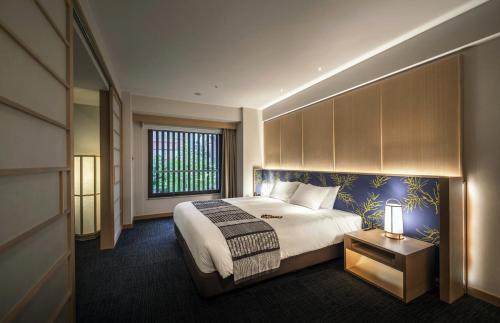 Un pat sau paturi într-o cameră la Noku Kyoto