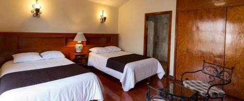 Hotel Posada Santa Berthaにあるベッド