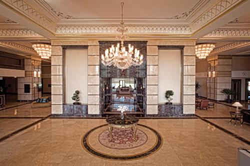 a large lobby with a chandelier and a table at Crowne Plaza Istanbul Asia by IHG in Istanbul