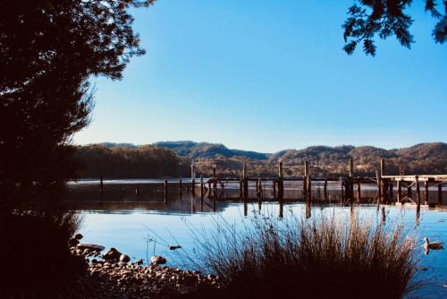 a body of water with a bridge over it at Salt Box Hideaway in Strahan
