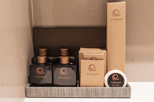 a box with a group of bottles of perfume at Rachabhura Hotel in Ratchaburi