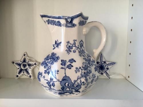a blue and white vase sitting on a shelf at Superb Scarborough Penthouse with Balcony, lift, parking, views in Scarborough