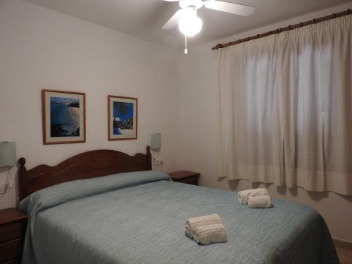 Postel nebo postele na pokoji v ubytování Apartamentos Jardin Playa