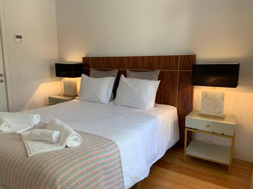 Postel nebo postele na pokoji v ubytování My Fair Lisbon - Deluxe Modern Apartment in Baixa Pombalina