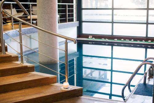 a staircase in a building with a candle on it at Domotel Xenia Volos in Volos