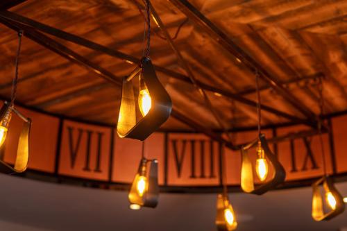 a bunch of lights hanging from a ceiling at The Bold Hotel; BW Signature Collection in Southport