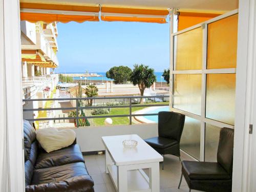 a living room with a couch and chairs on a balcony at Apartment Sol Y Mar by Interhome in Altea