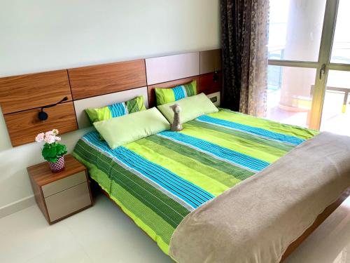 Una cama o camas en una habitación de Vista Bella. Apartamentos