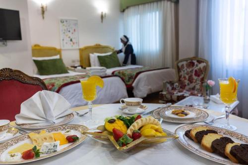 a table with plates of food on top of it at San Giovanni Stanly Hotel in Alexandria