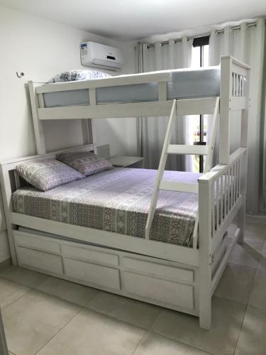 a white bunk bed in a room at Wai Wai Cumbuco Eco Residence in Cumbuco