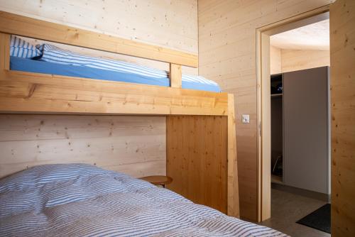 Postel nebo postele na pokoji v ubytování Labbrunnu OG in den Walliser Alpen
