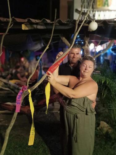 a man and a woman standing next to each other at Ko Yao Noi Sabai Bungalows in Ko Yao Noi