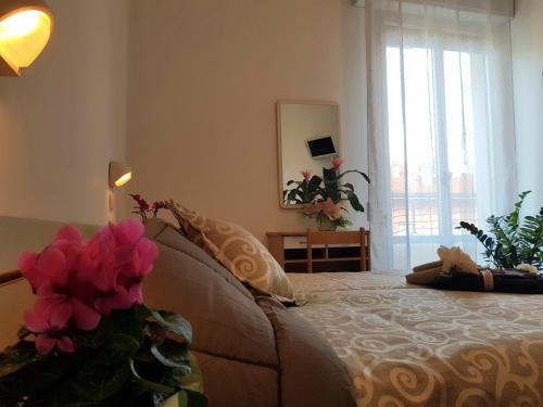 Letto o letti in una camera di HOTEL ROMANTICA