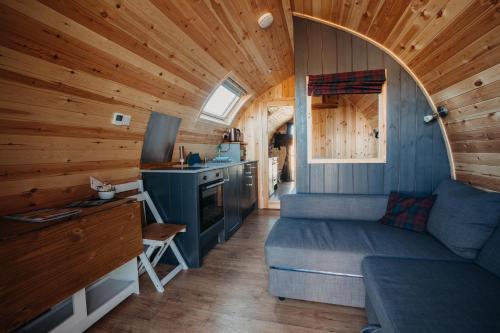 a small room with a bed and a kitchen at North Coast 500 Pods in Achmelvich