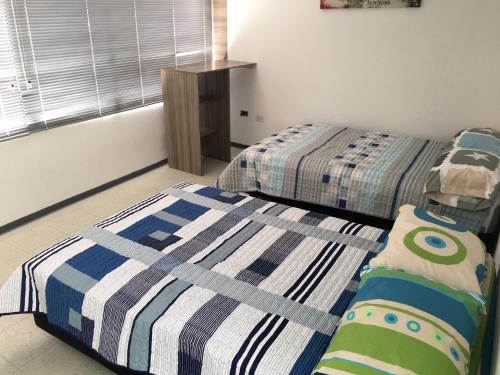 Postel nebo postele na pokoji v ubytování Estadía El Dorado