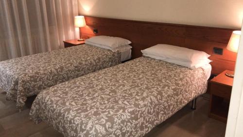 Postel nebo postele na pokoji v ubytování Hotel Select