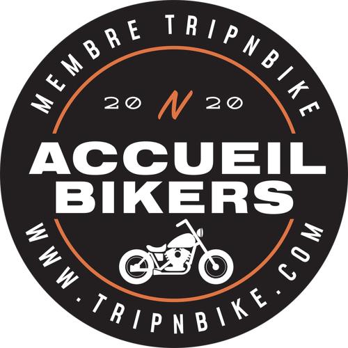 a sign for a motorcycle shop with a motorcycle at La Cour des Amis in Vendenheim
