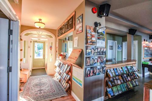 a book store with a lot of books on the wall at La Secousse in La Malbaie