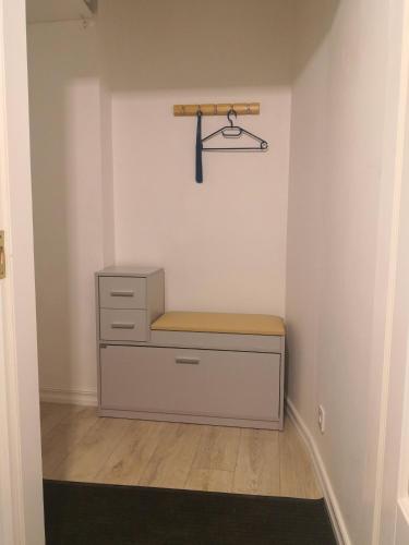 a room with a dresser and a shelf on the wall at Mario Studio in Vilnius