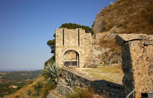 an old building on the side of a mountain at Polytropon Studio ground floor in Kefallonia