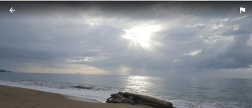 a picture of the sun shining on the beach at Casa Del Mar !!! Ocean front villa in Aguada