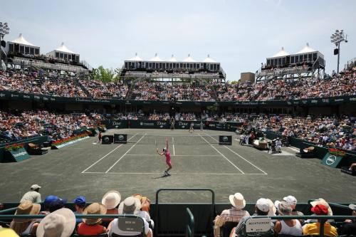a tennis player serving the ball on a tennis court at Falling Moss in Porcher Bluff