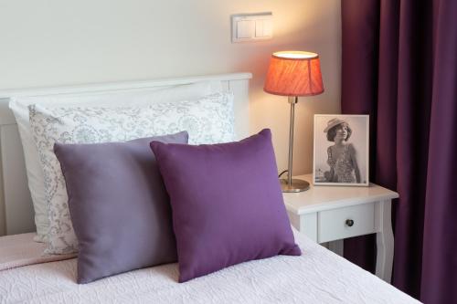 A bed or beds in a room at JOY Style Vilamoura apartment