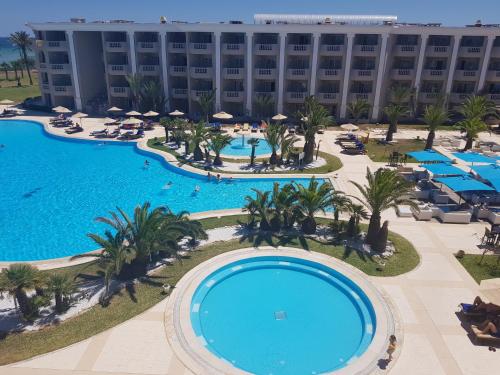 an aerial view of a hotel with a large pool at Royal Thalassa Monastir in Monastir