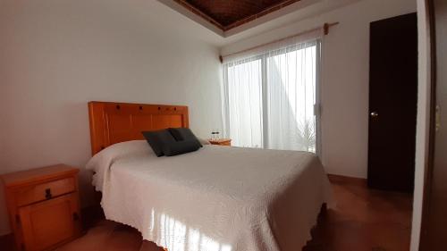 Postel nebo postele na pokoji v ubytování Villas Amalur